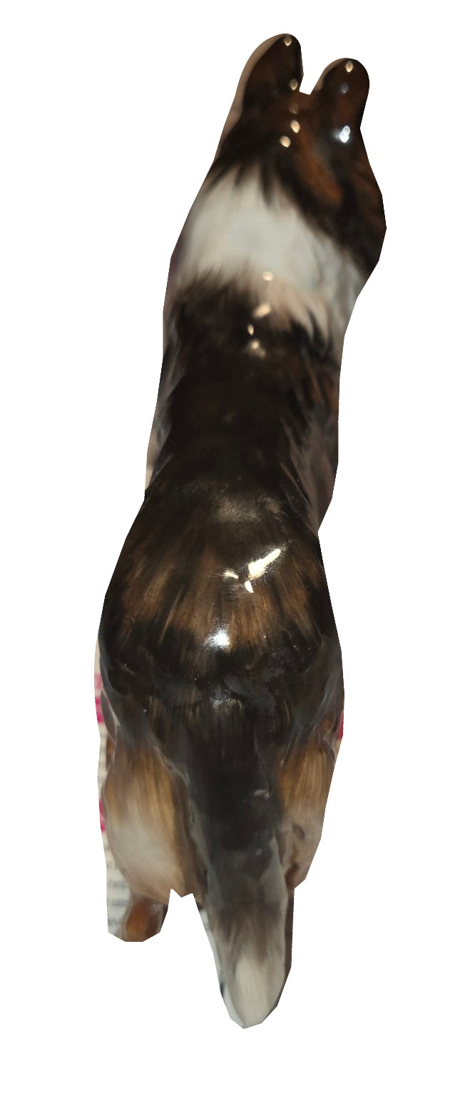 Royal Doulton collie figurine rear view on white background