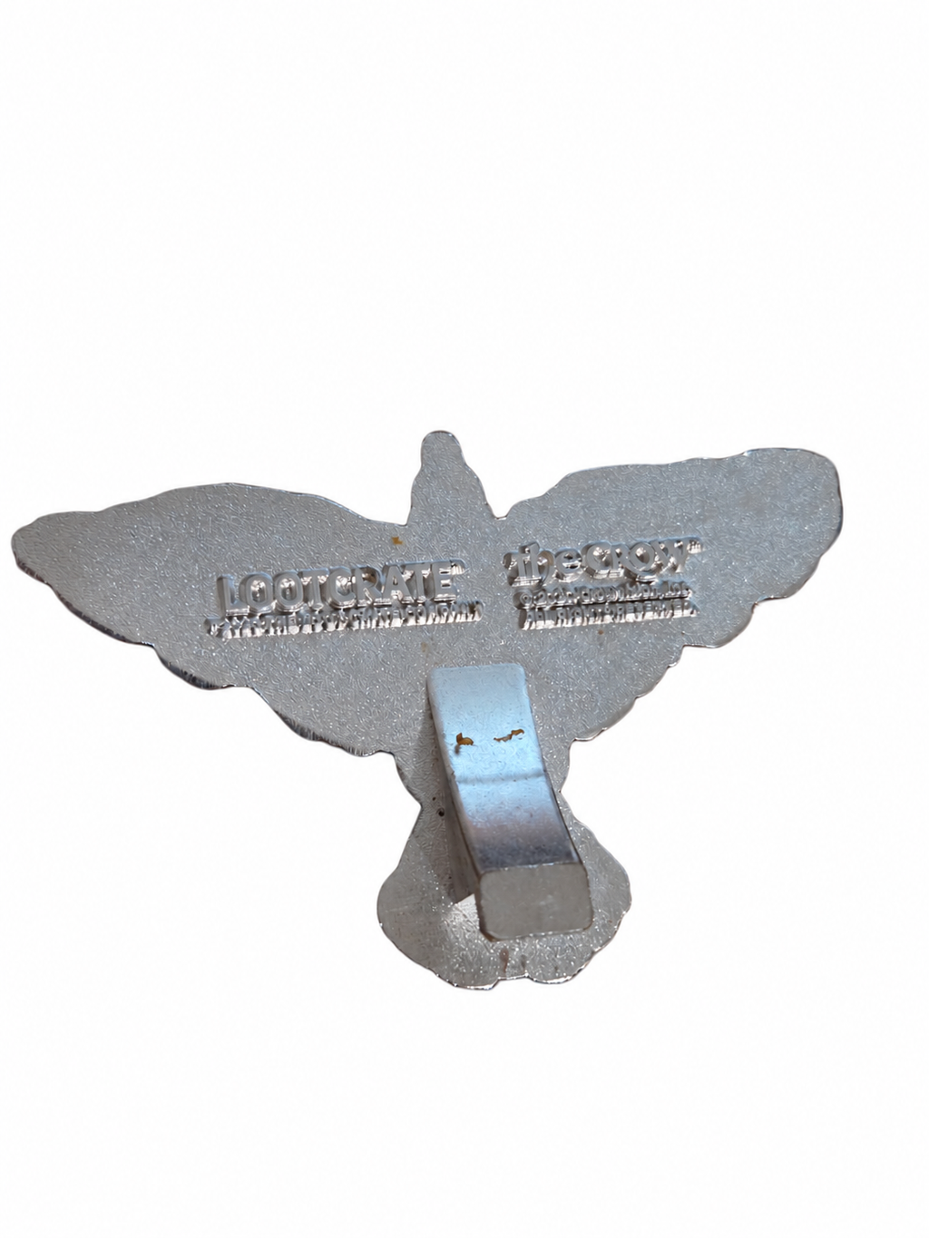 The Crow Loot Crate bottle opener back showing scratches and brown marks